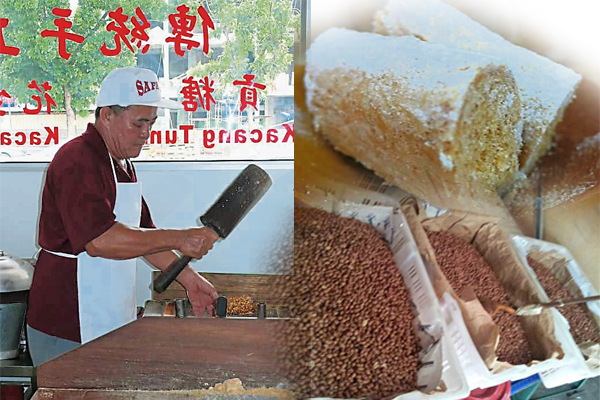 洪启成埋头专注地捶打着贡糖原材料。