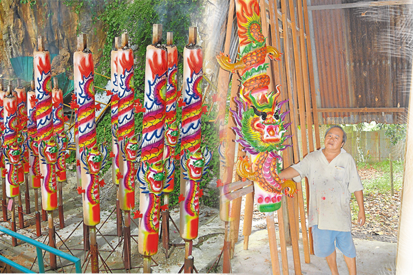 王进财展示其采用具有荧光效果的颜料所制作24尺立体龙香。