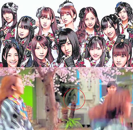 窗边的“女子”出现在《10年樱》MV里看着AKB48的美眉热舞。