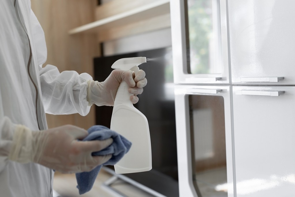 Virologists, people in protective suits carry out the disinfecti