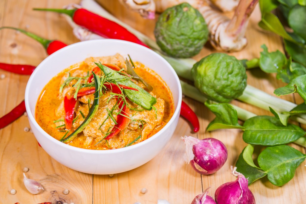 Thailand Food Curry pork spicy on wood table. Thailand call Panang.