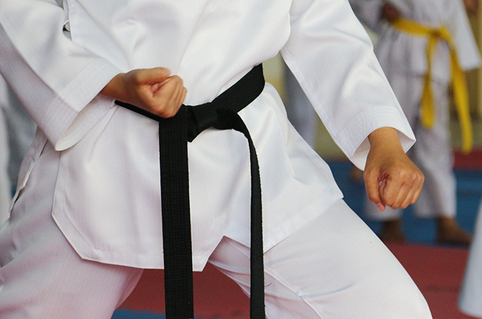 Taekwondo kids athletes. Moment of athlete to warm up and strike an opponent during the tournament taekwondo kids