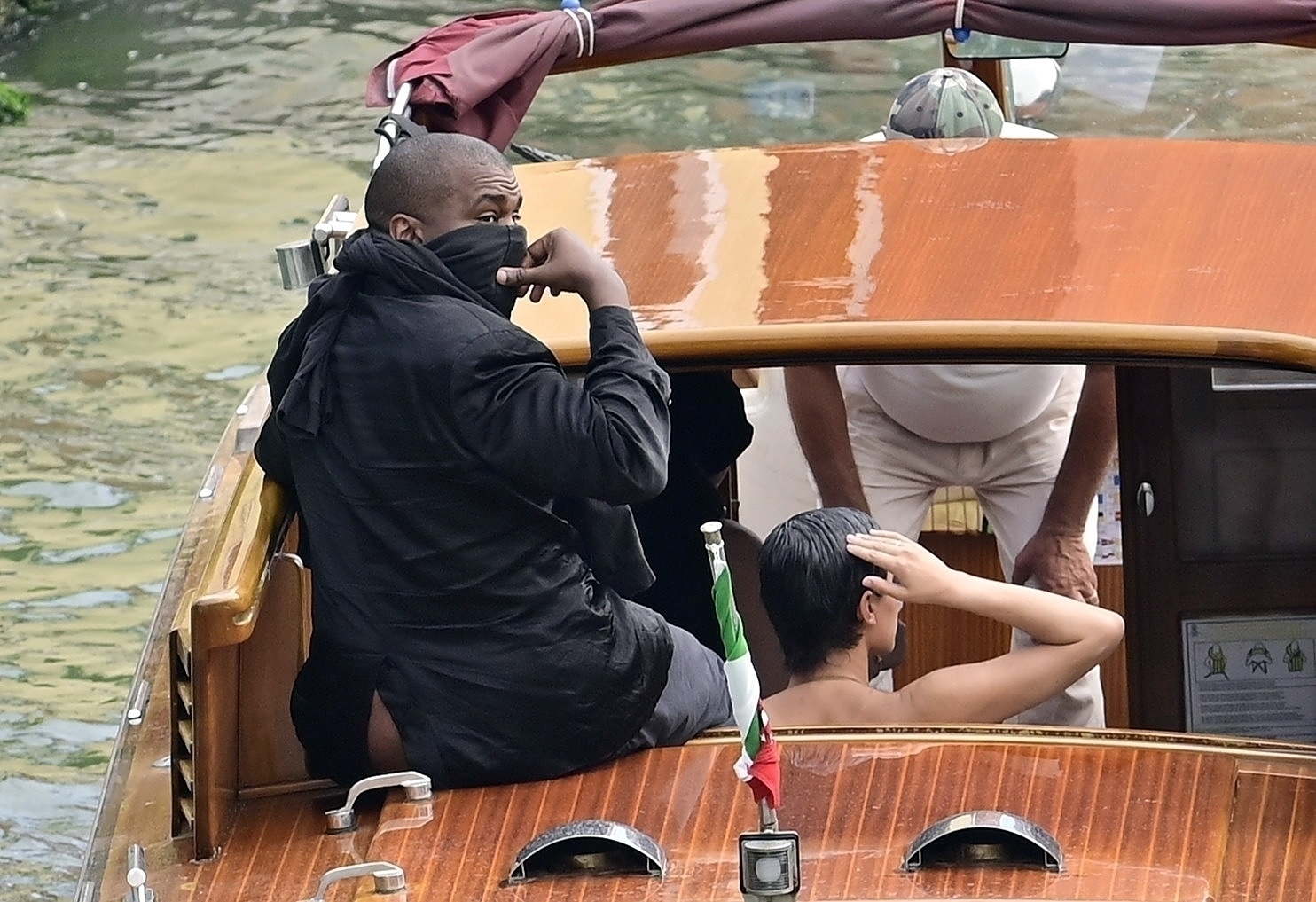 *PREMIUM-EXCLUSIVE* VENICE, ITALY  - *MUST CALL FOR PRICING* *NO WEB USE UNTIL FURTHER NOTICE*  Music mogul Kanye West has a wardrobe malfunction as his rear end is on show to passing tourists as he takes a river taxi with his wife Bianca Censori and a female friend on Venice's canal. SHOT ON 08/27/2023 Pictured: Kanye West - Bianca Censori BACKGRID USA 28 AUGUST 2023  BYLINE MUST READ: COBRA TEAM / BACKGRID USA: +1 310 798 9111 / usasales@backgrid.com UK: +44 208 344 2007 / uksales@backgrid.com *UK Clients - Pictures Containing Children Please Pixelate Face Prior To Publication* *PREMIUM-EXCLUSIVE* *MUST CALL FOR PRICING* *NO WEB USE UNTIL FURTHER NOTICE* Kanye West has a wardrobe malfunction as his rear end is on show to passing tourists as he takes a river taxi with his wife Bianca Censori on Venice's canal