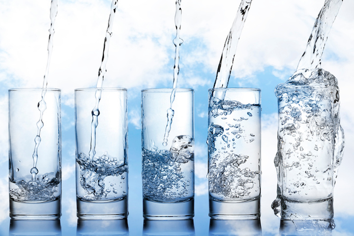 stages of pouring water into a glass