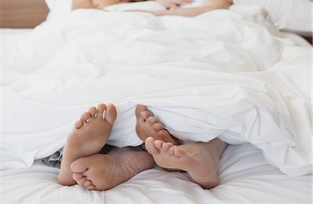 6109-07601539 © Masterfile Royalty-Free Model Release: Yes Property Release: Yes Full length of loving young couple in bed