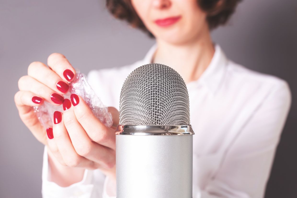 Unrecognisable girl is about to do autonomous sensory meridian response or ASMR microphone popping the bubble wrap. Trigger sounds for stress and anxiety attack relief, good sleep.; Shutterstock ID 1802991208; purchase_order: Arnaud POURPOINT; job: ; client: ETX Studio / Daily Up; other:
